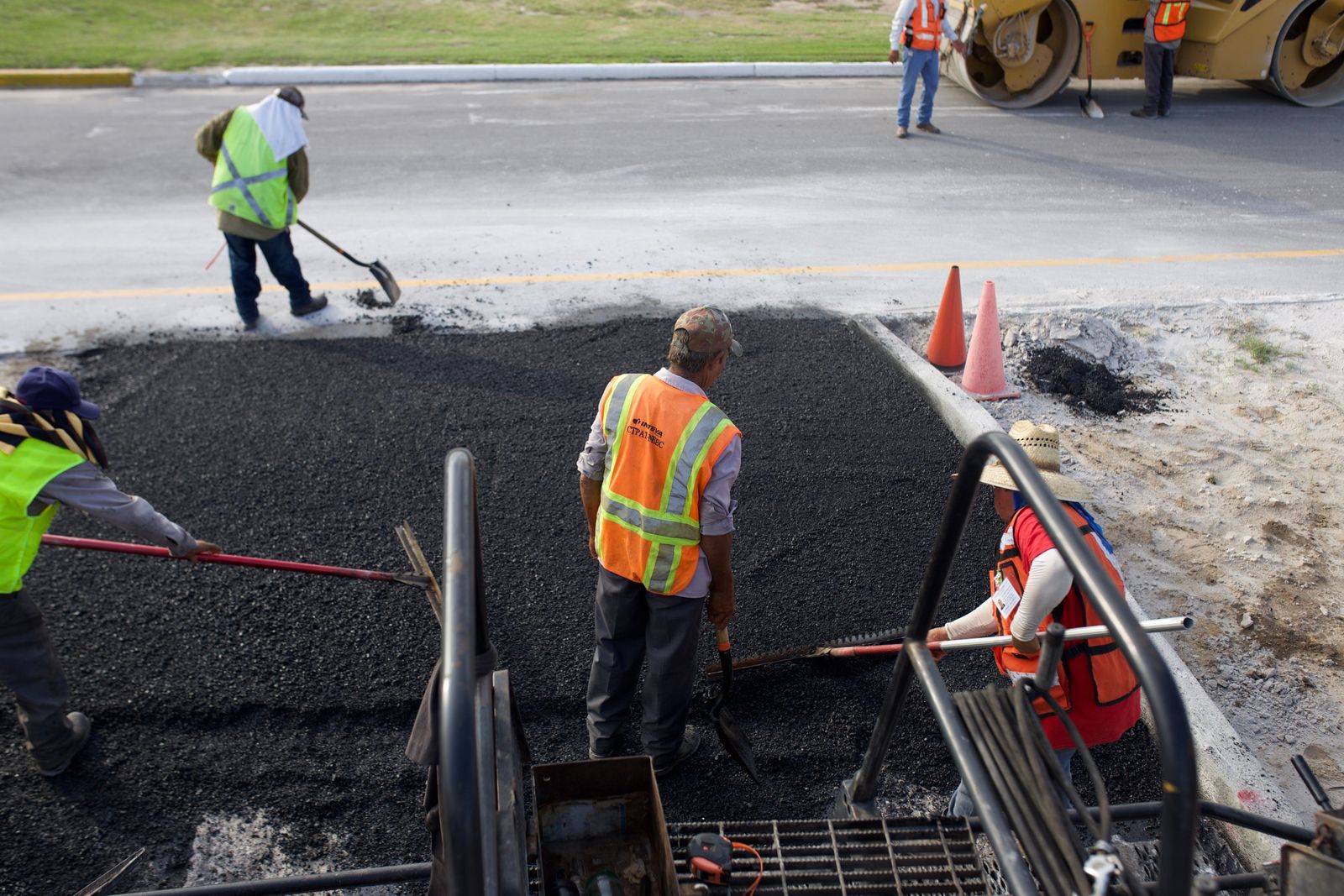 Iron Ridge Pavement crew laying fresh asphalt on a road in Central Florida
